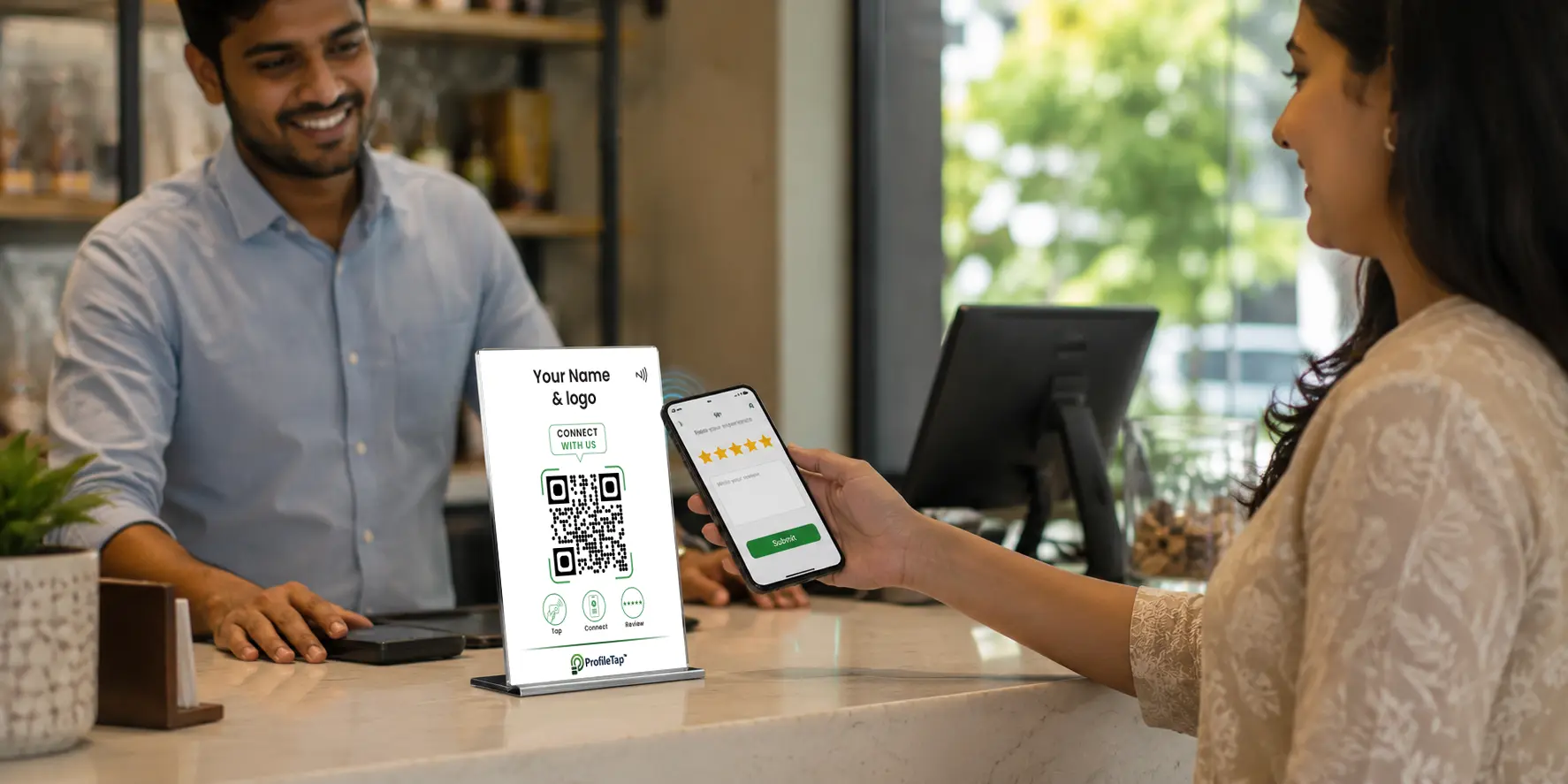 A customer tapping a phone on a ProfileTap Google review QR code to open the review page