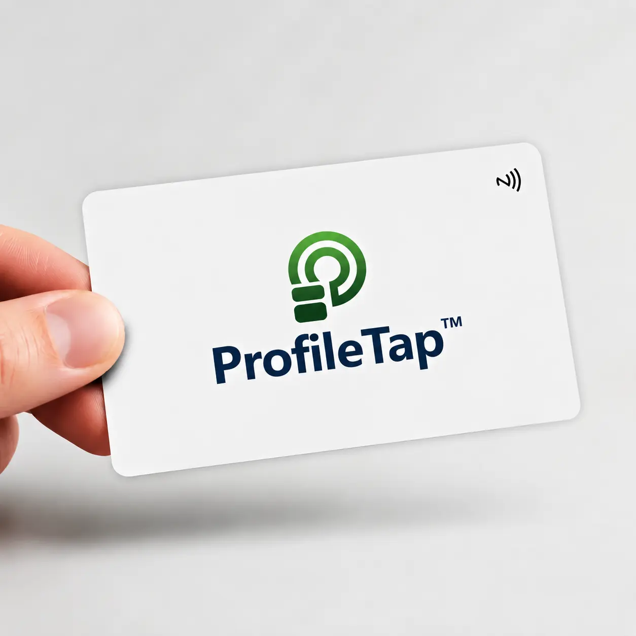 A ProfileTap white PVC NFC business card being tapped on a phone to open a live profile