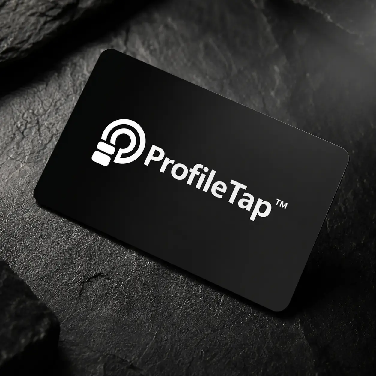 A ProfileTap matte black PVC NFC business card being tapped on a phone to open a live profile
