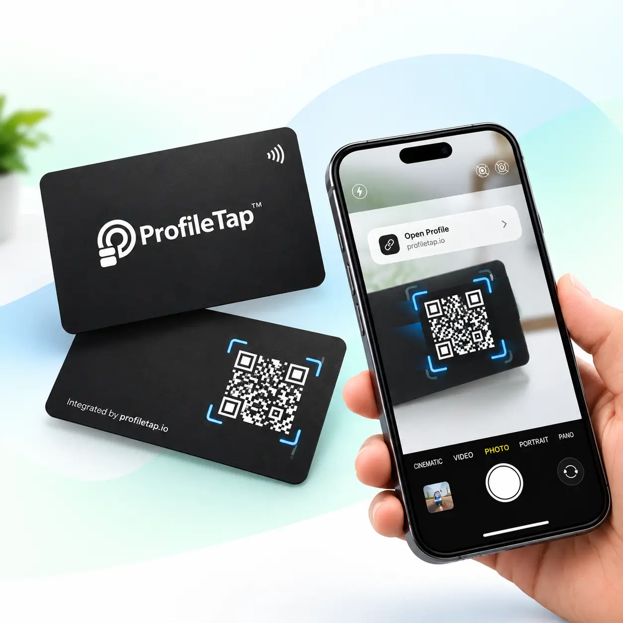 A phone scanning the QR code on a metal team card